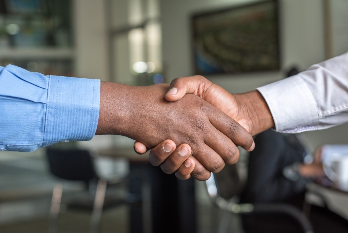 Shaking hands at the start of a new engagement